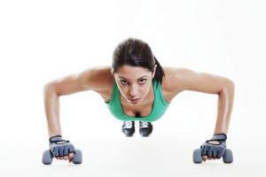 Young woman doing push ups