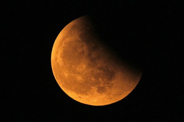 The shadow of the Earth is seen on the Moon during a total lunar eclipse in Shanghai