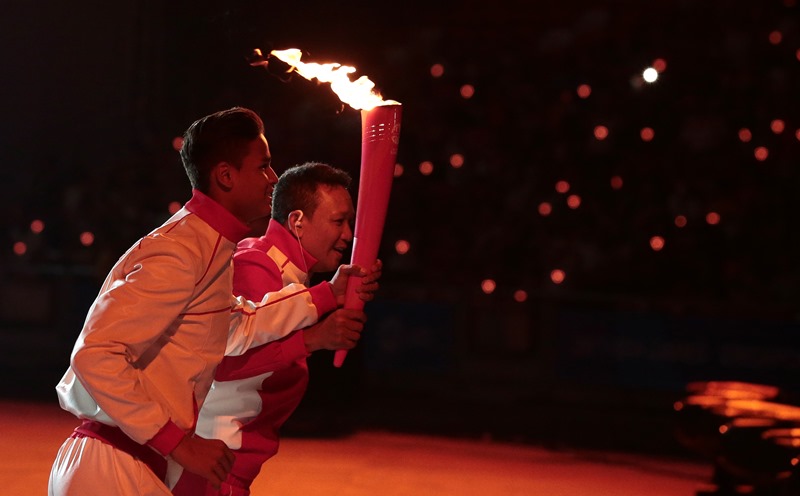 28th SEA Games Singapore 2015 - National Stadium, Singapore - 5/6/15 Opening Ceremony - Fandi Ahmad (R) and Irfan Fandi during the Torch Relay TEAMSINGAPORE SEAGAMES28 Mandatory Credit: Singapore SEA Games Organising Committee / Action Images via Reuters