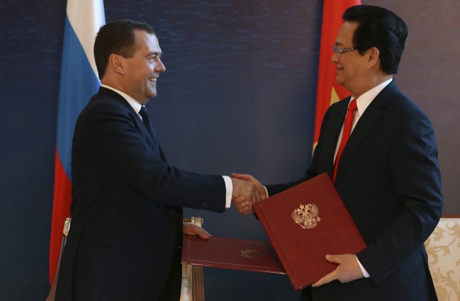Russian Prime Minister Medvedev shakes hands with his Vietnamese counterpart Nguyen Tan Dung during signing ceremony in Burabai