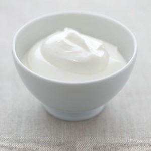 A70XP0 Greek yogurt in white ceramic bowl with spoon - high end Hasselblad 61mb digital image. Image shot 2006. Exact date unknown.